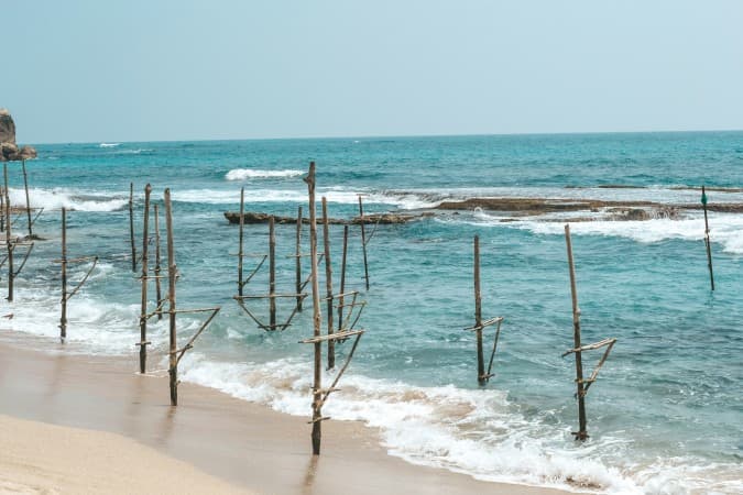 Stilt fishing in Mirissa by Filiz Elaerts